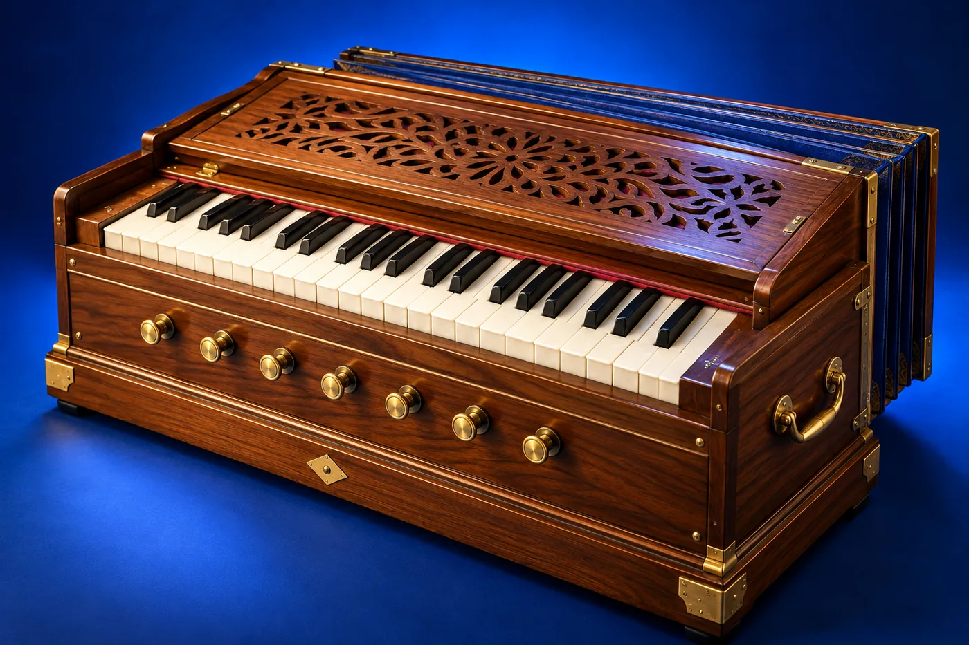 Wooden portable harmonium showing its keyboard, front stops, carved sound grille, and rear bellows